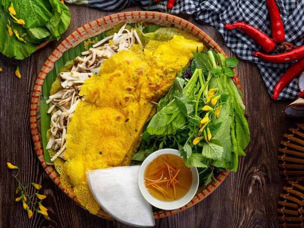 Nằm mơ thấy ăn bánh xèo là điềm tốt hay xấu, số gì hên?